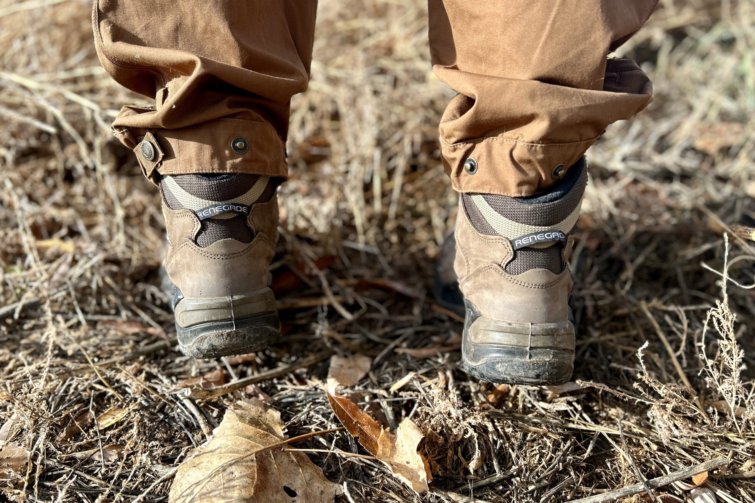 Close up picture of a pair of hiking boots from behind, showing the heel structure.