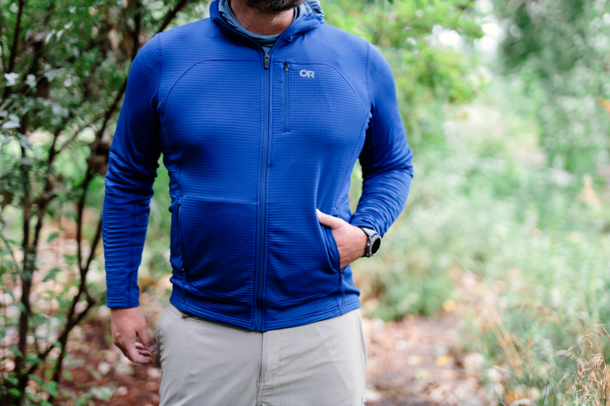 a man with his hand in his pocket while wearing Outdoor Research Vigor Fleece Jacket