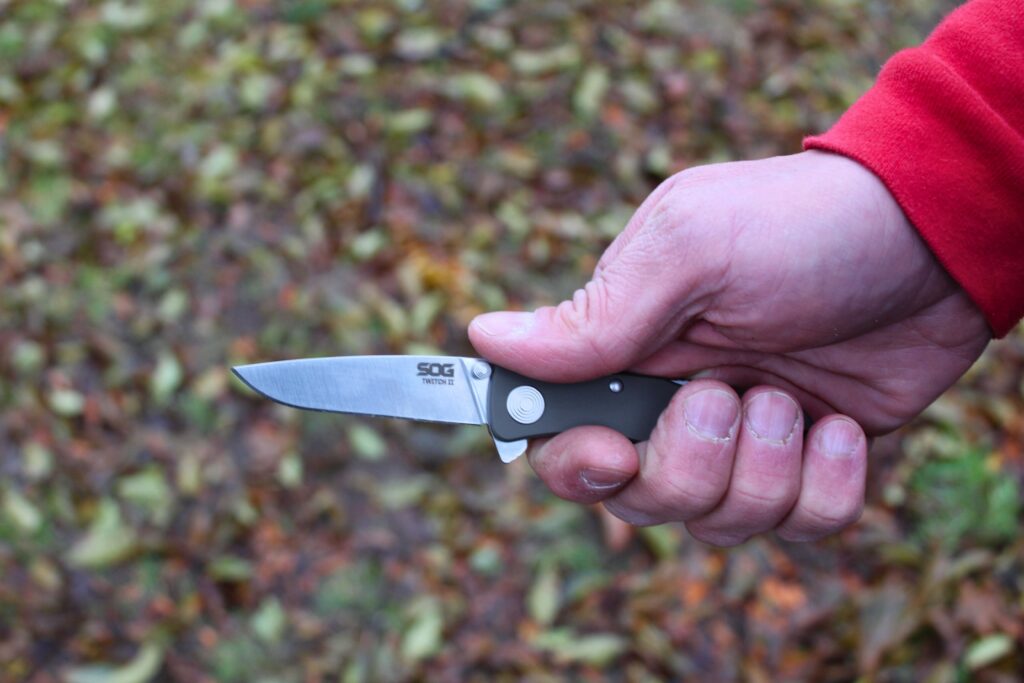 Holding the SOG Twitch II pocket knife while open