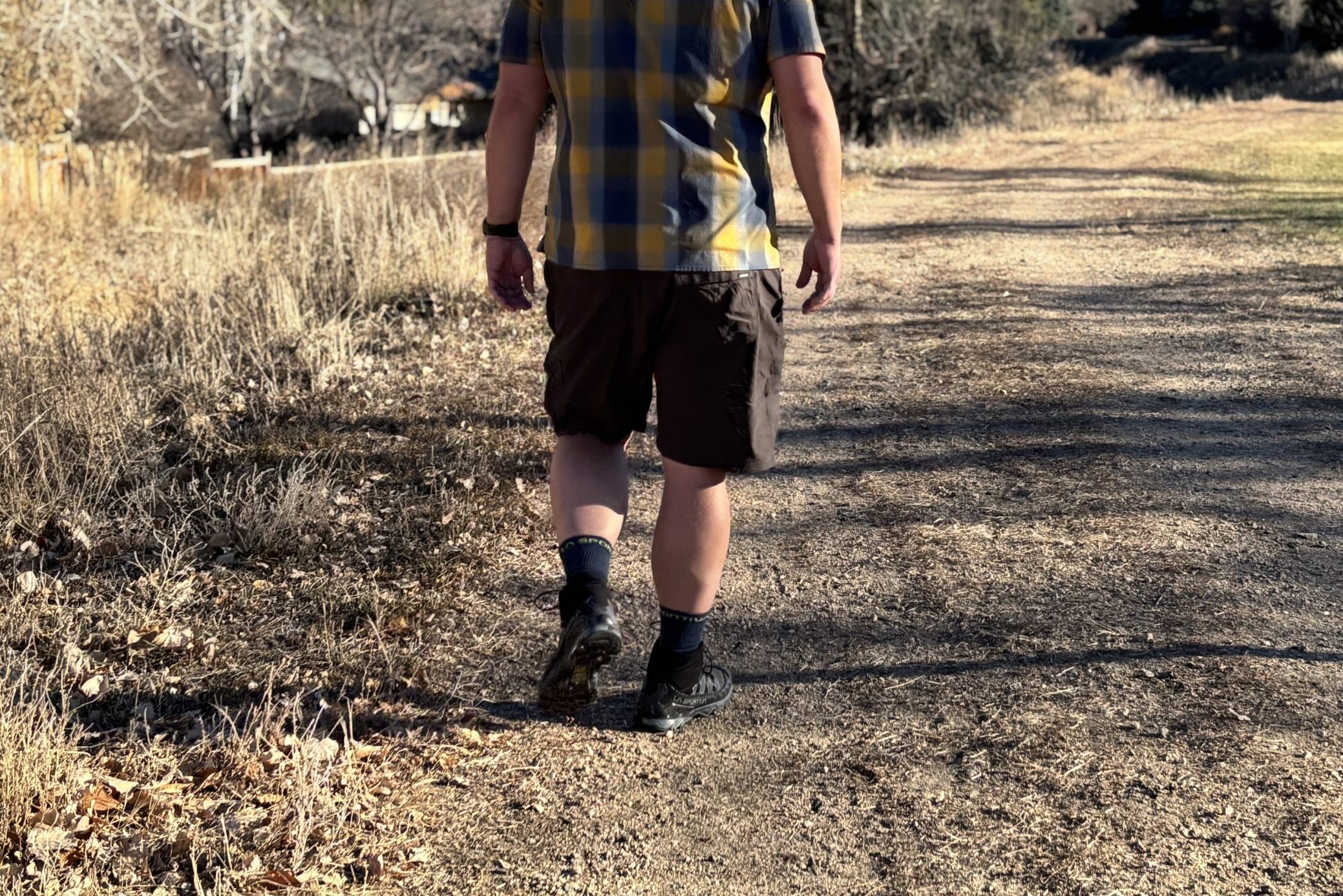 Man walking down a trail.