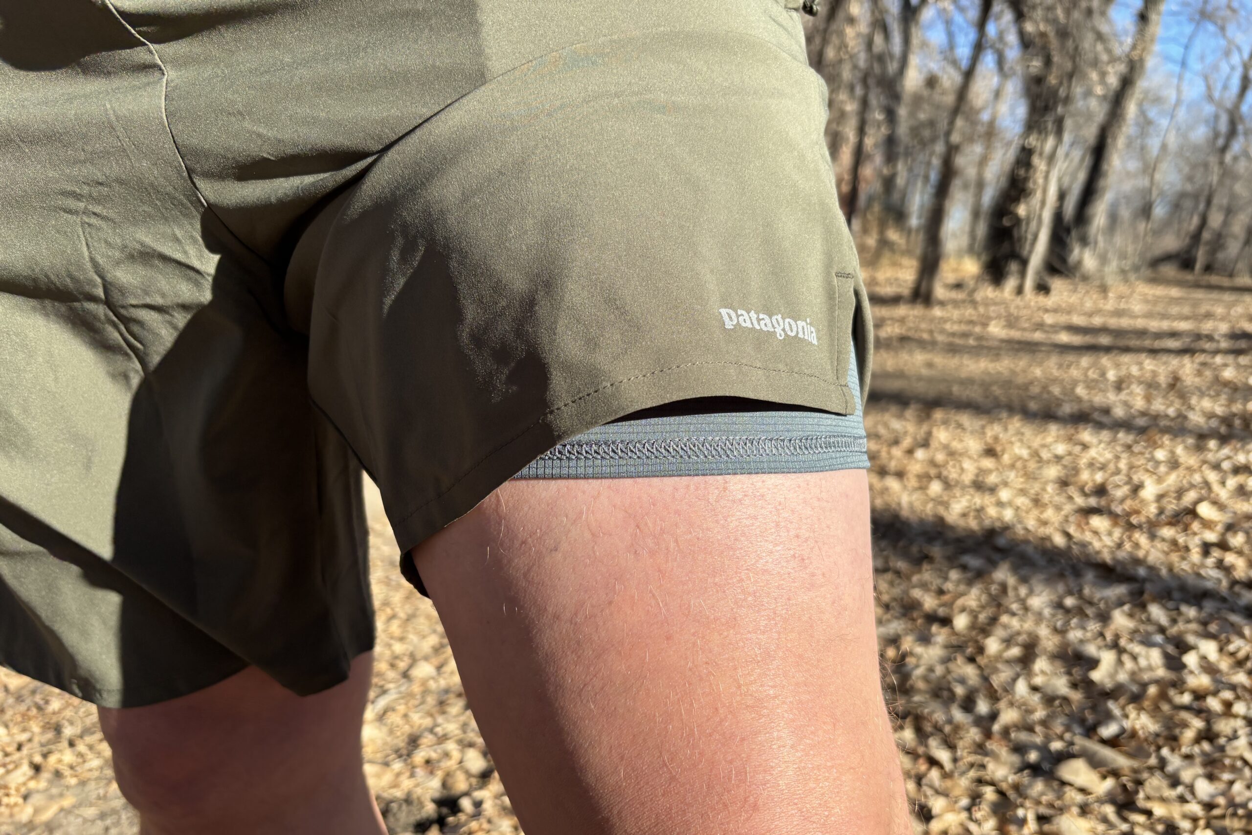 The hem of a shorts revealing the liner underneath.