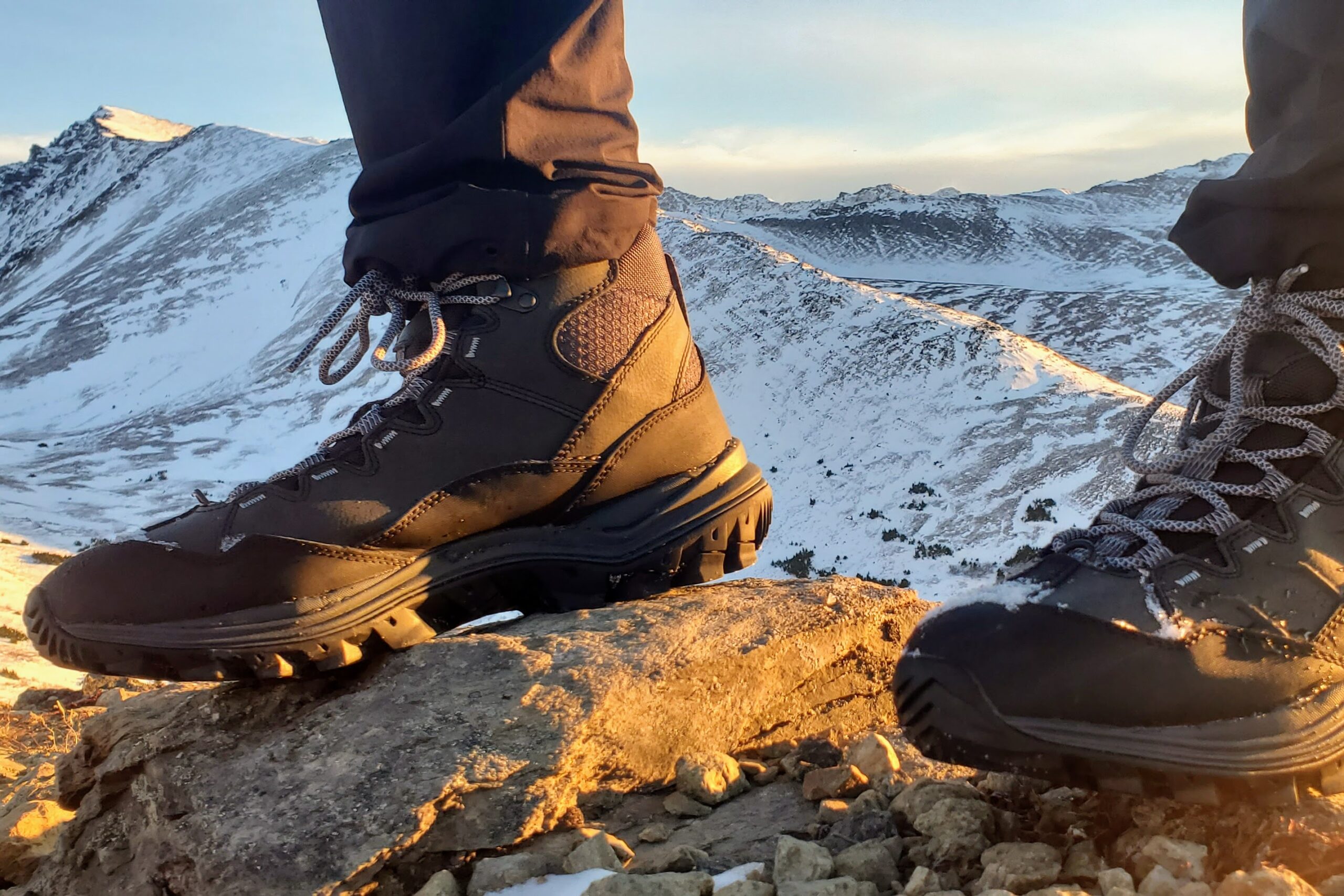 A closeup of the inside of boots on a mountaintop.