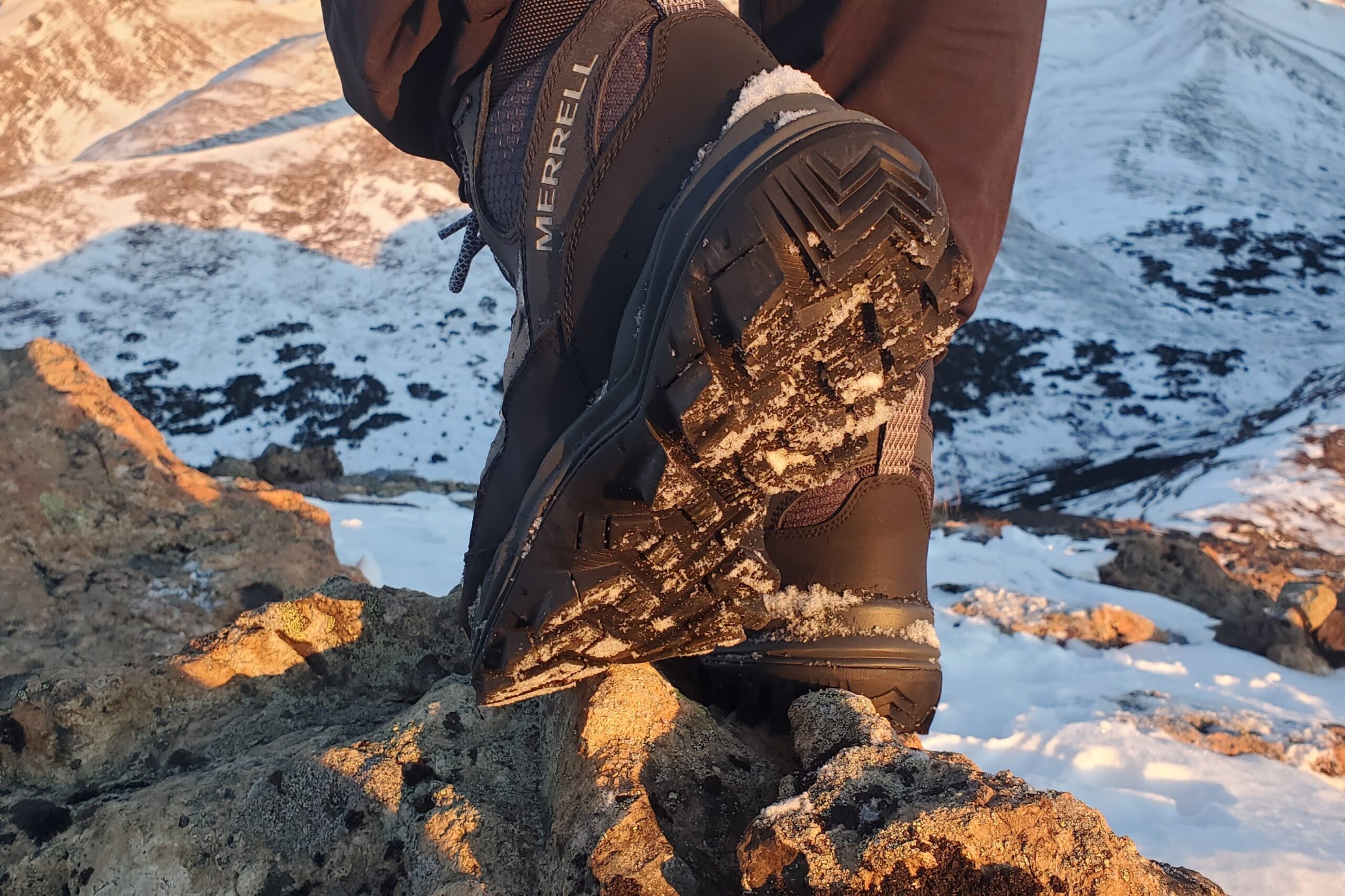 A closeup of the tread of hiking boots