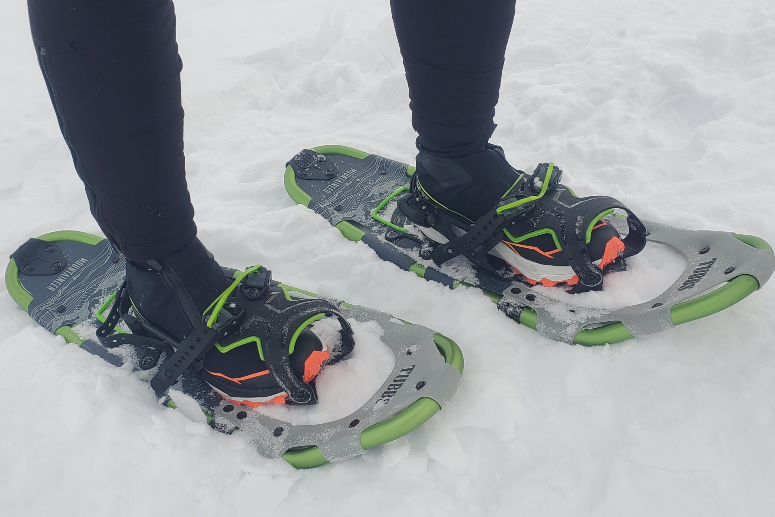 A closeup of snowshoe bindings