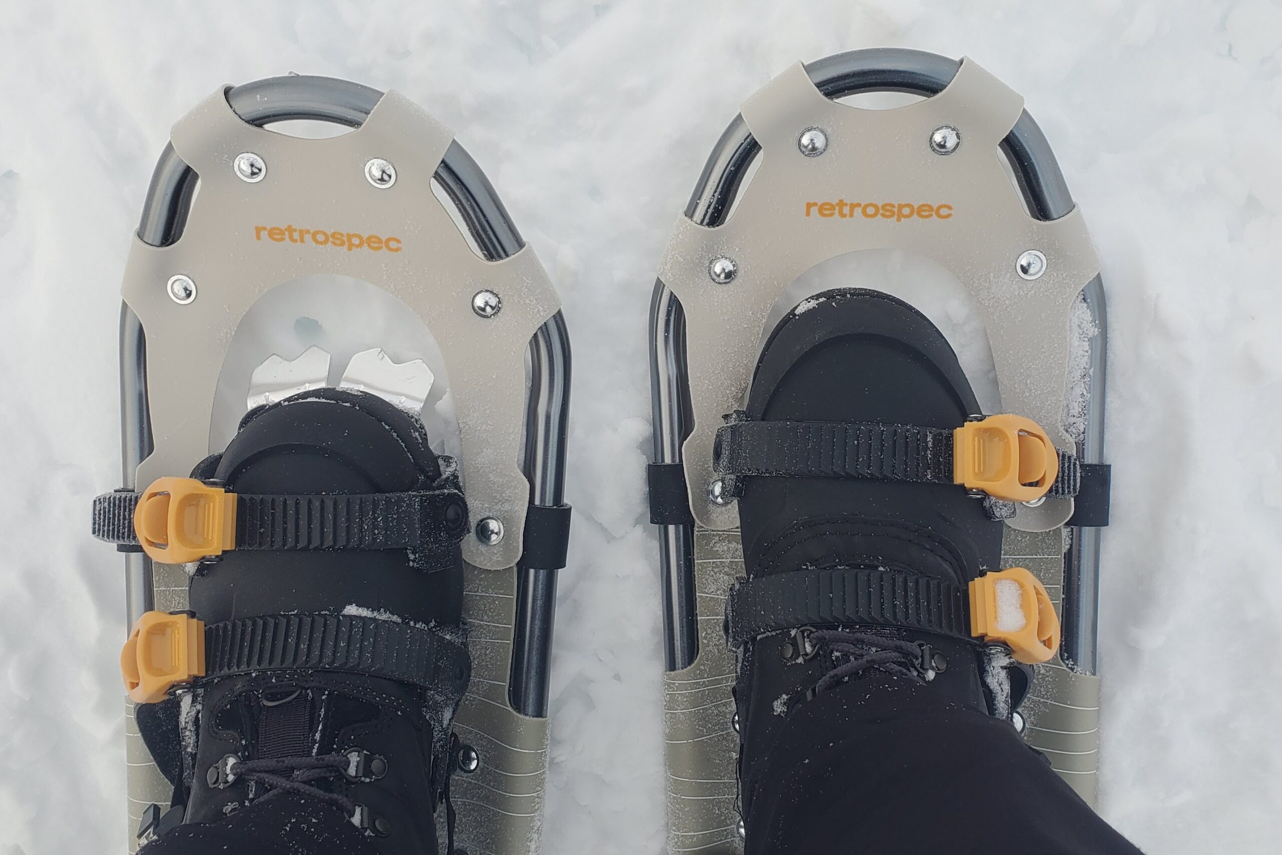 A closeup of snowshoe bindings