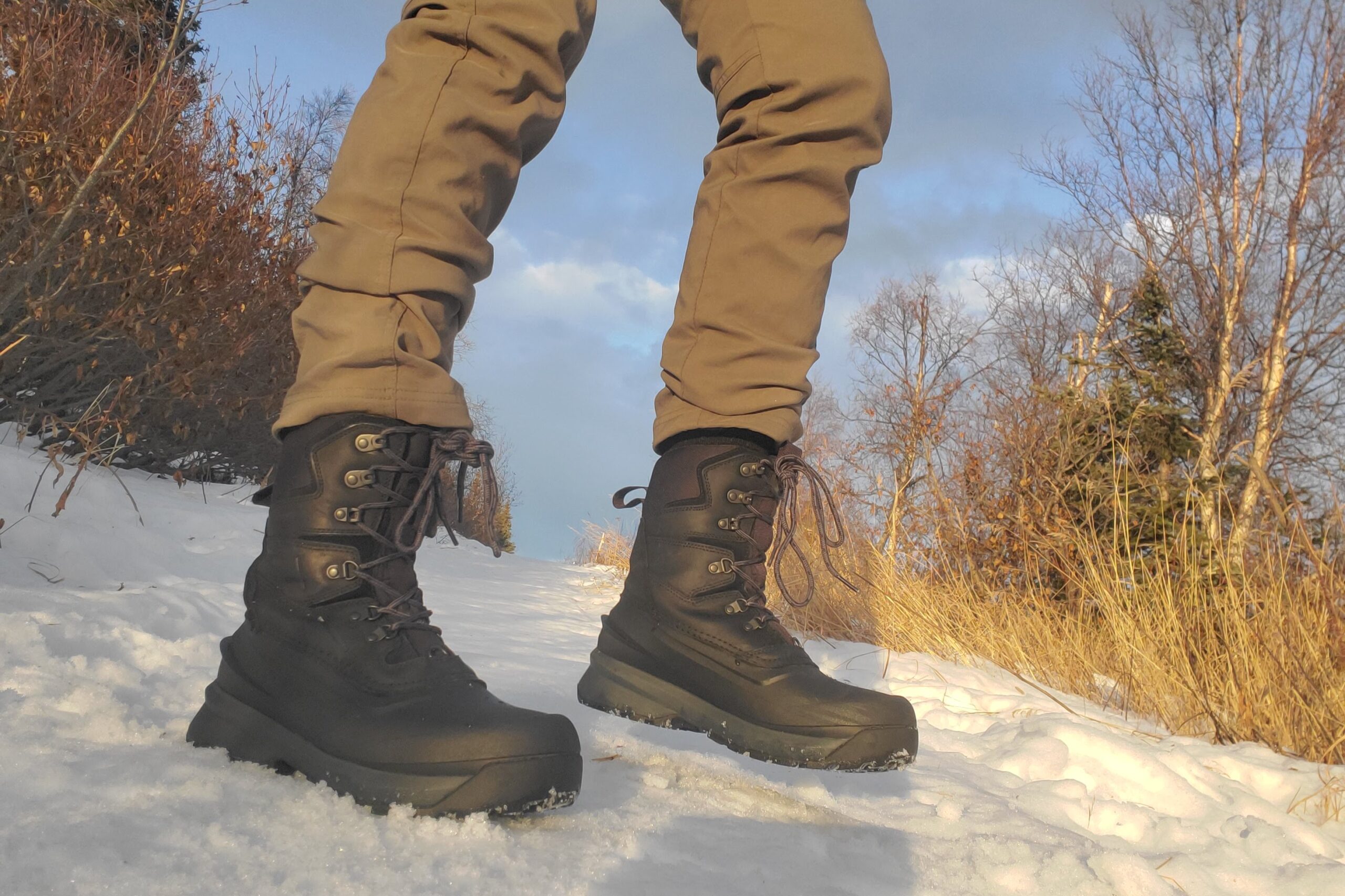 A pair of boots on a sunlit trail