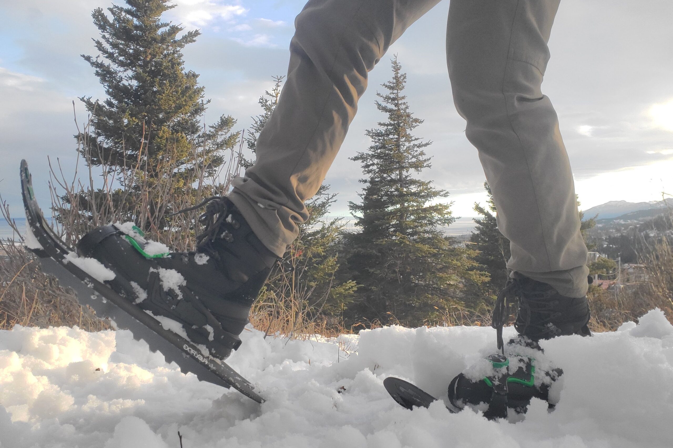 A pair of snowshoes is used in deep snow.