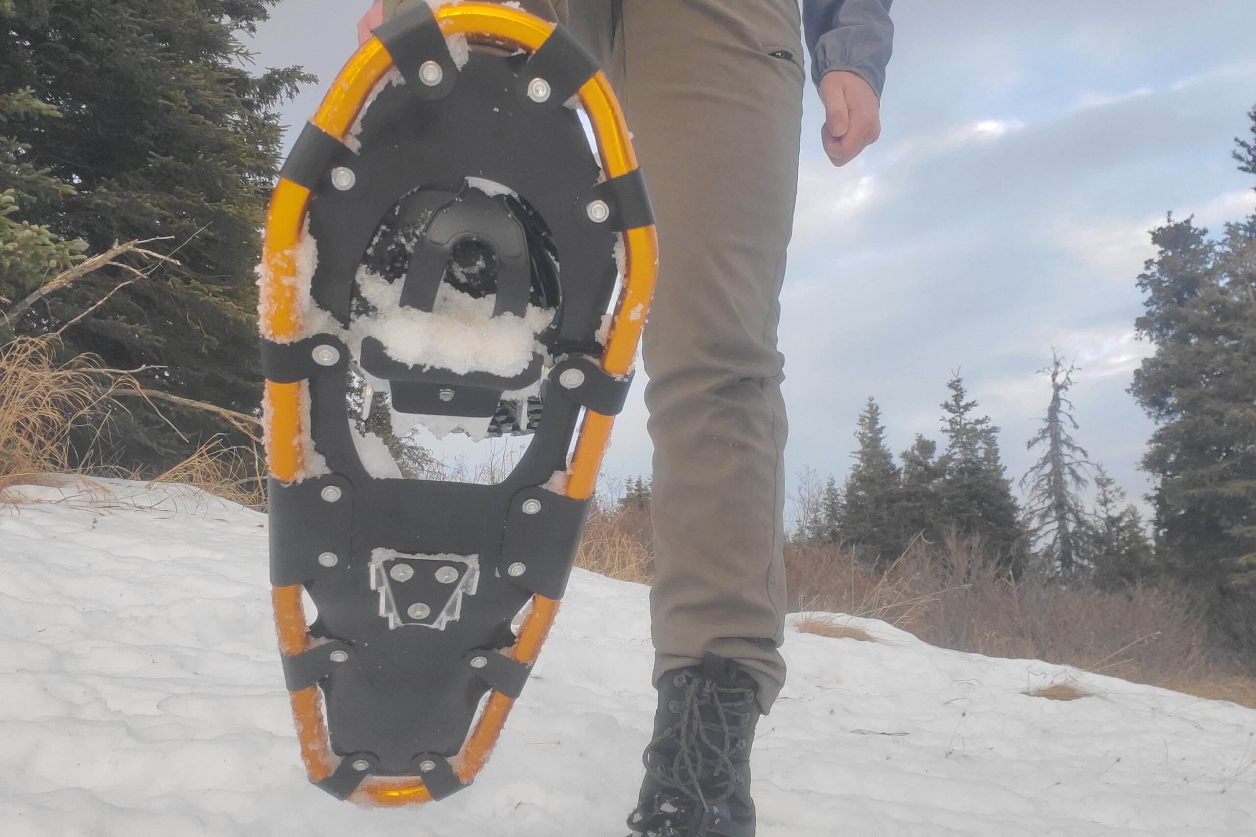 The underside of snowshoes while taking a step.