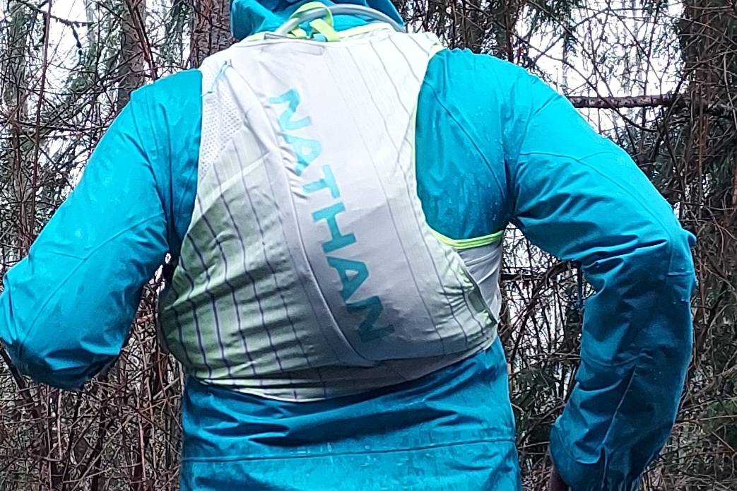 Runner wearing the Nathan Pinnacle 12 Hydration Race Vest