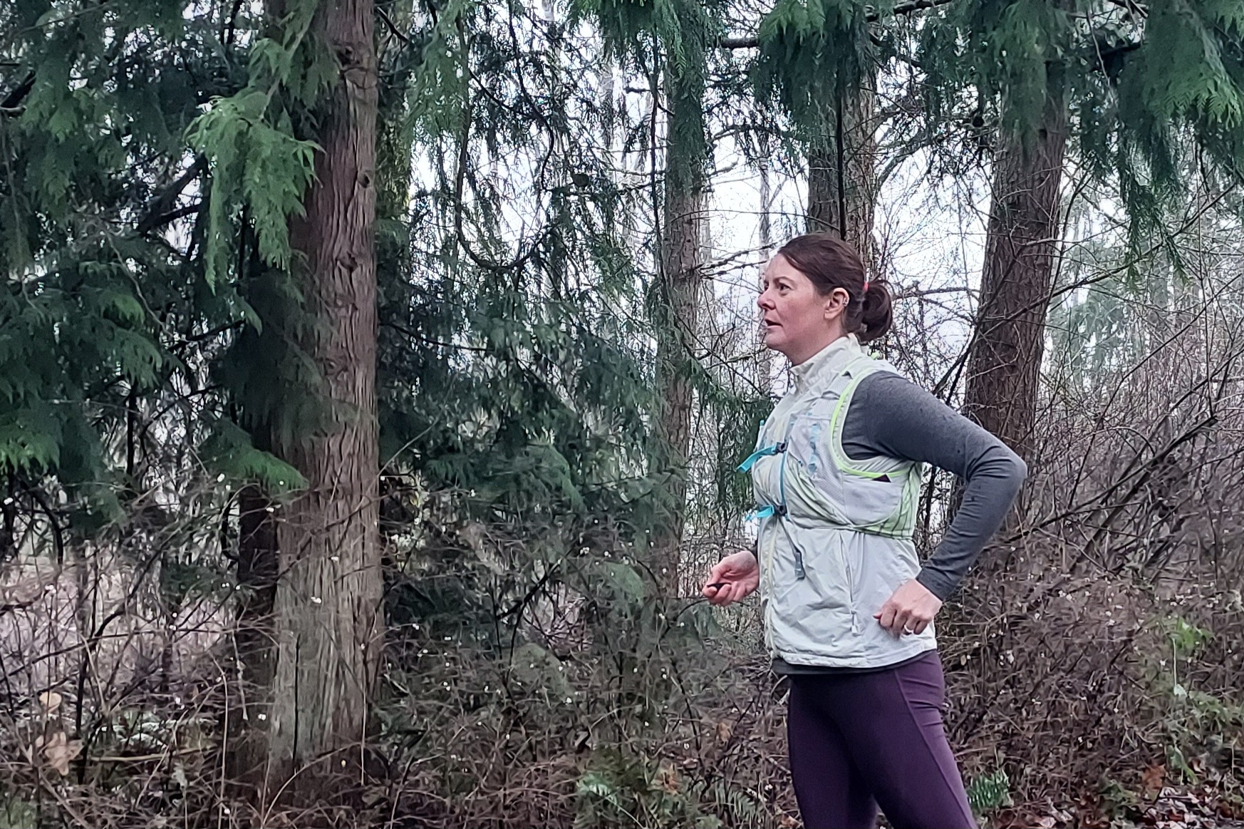 Runner wearing the Nathan Pinnacle 12 Hydration Race Vest