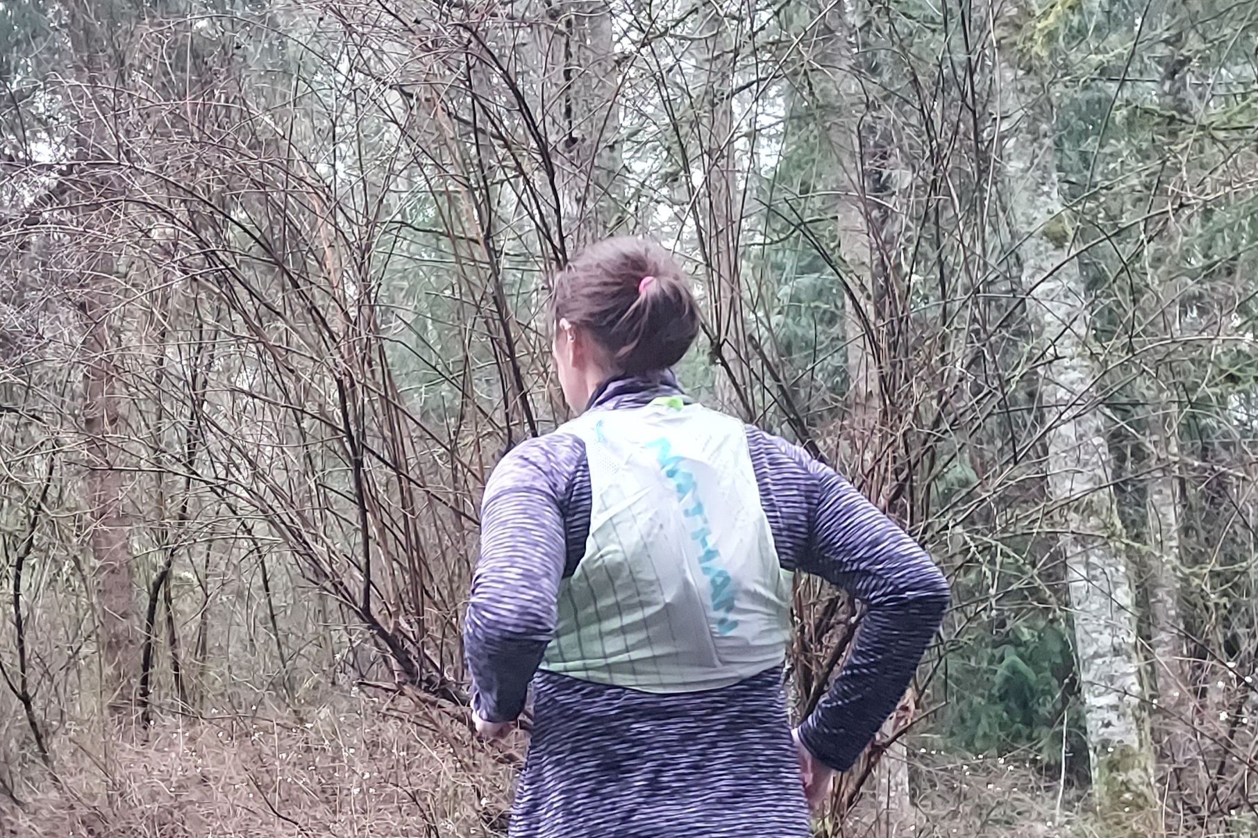 Runner wearing the Nathan Pinnacle 12 Hydration Race Vest