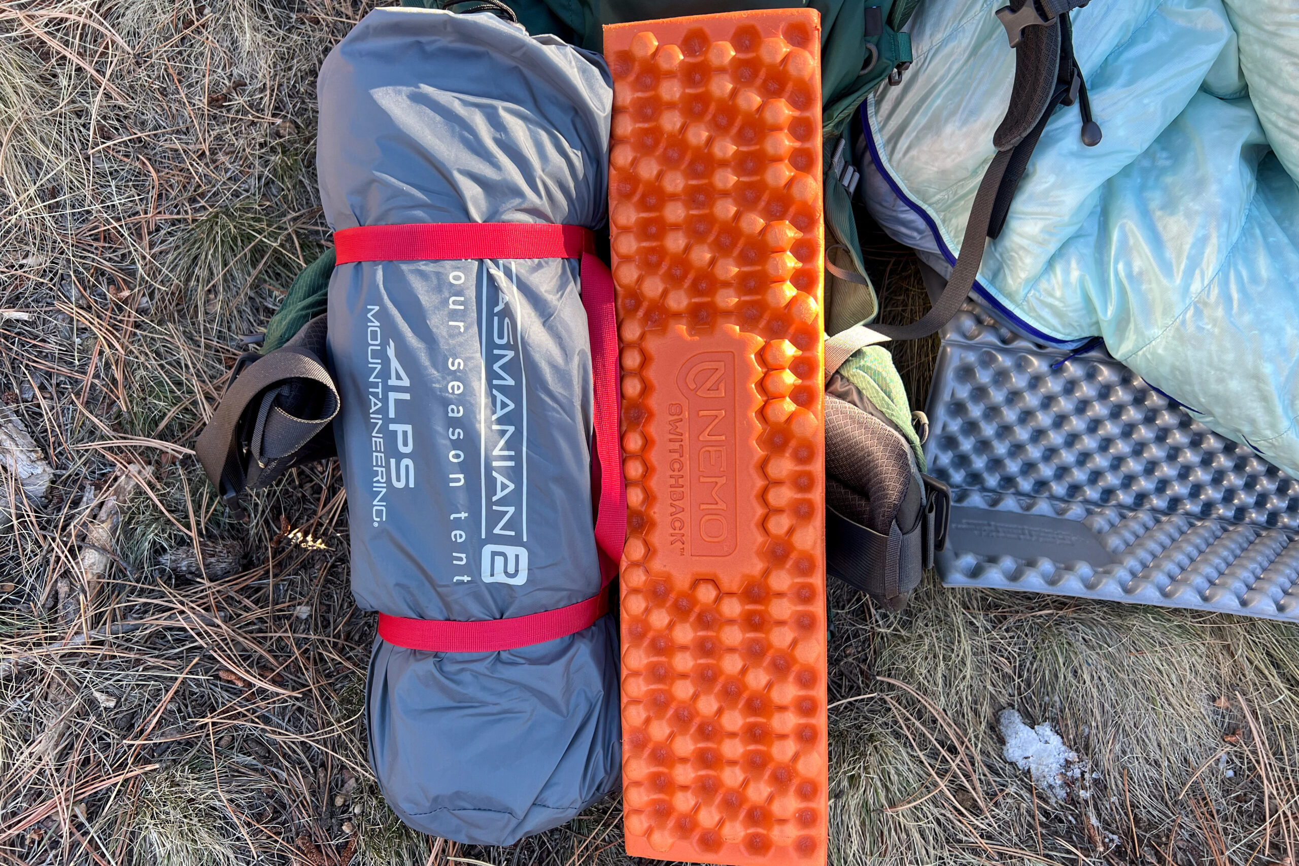 Packed Alps Mountaineering Tasmanian 2 tent next to a Nemo Switchback pad