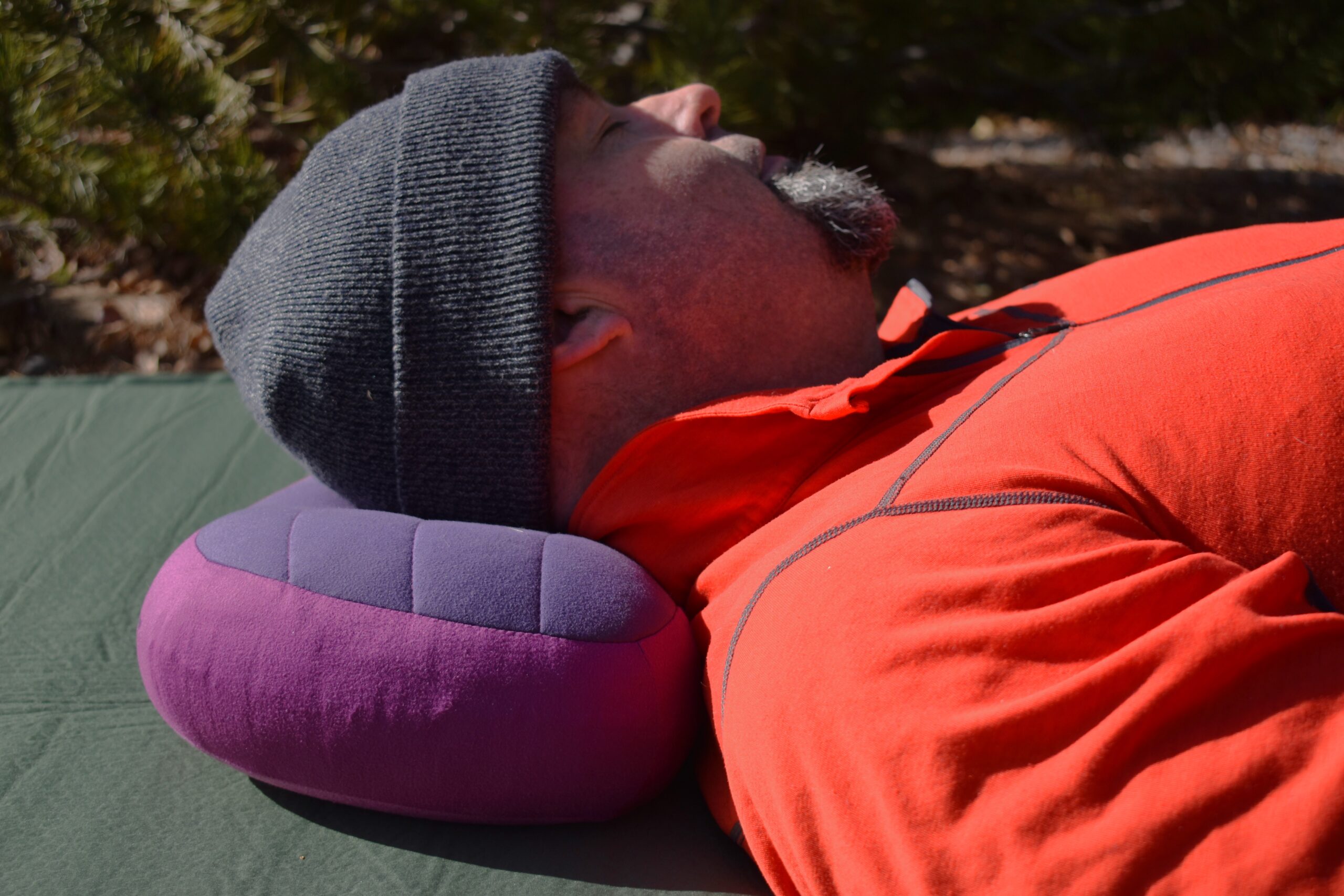 Close up of the Sea to Summit Aeros Premium Pillow supporting the head and neck of a sleeping backpacker