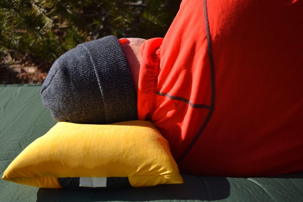 A side sleeper's neck is clearly crooked on the NEMO Fillo Elite Luxury pillow