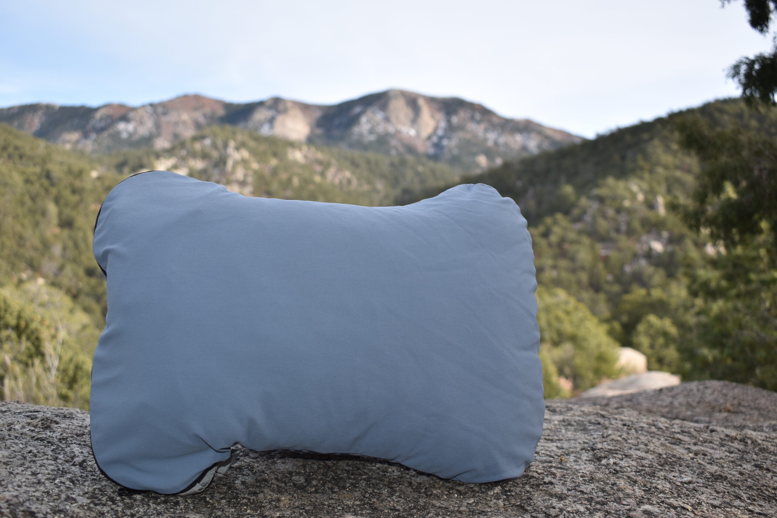 Close up of HEST camp pillow in the New Mexico mountains