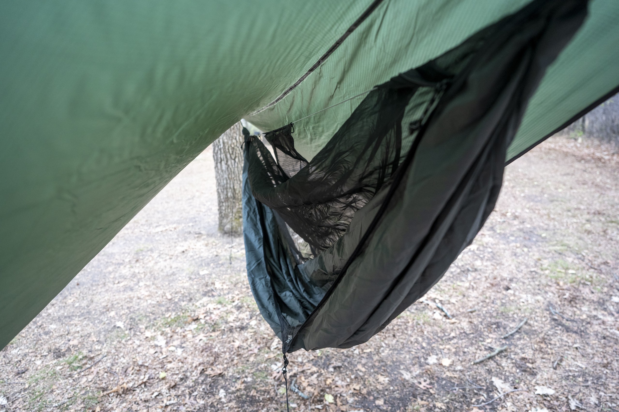 a view of a hammock hanging under a tarp