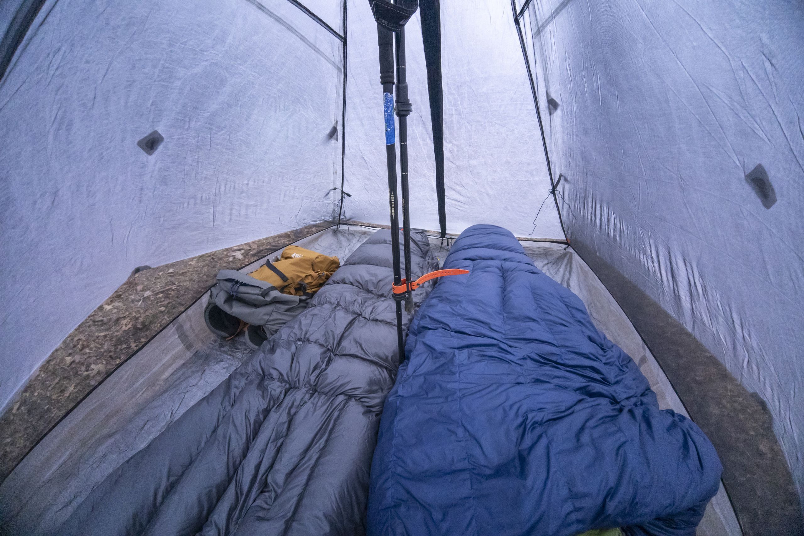 two sleeping bags in a pyramid tent