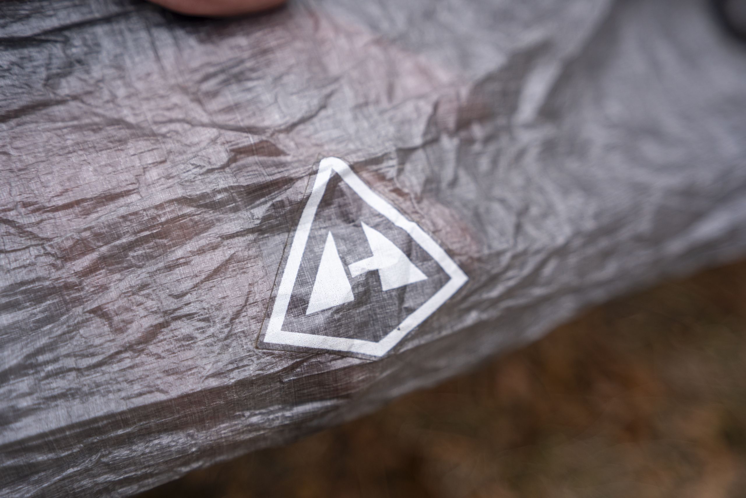 a logo on the fabric of a tent