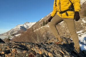 A man walks along a rocky outcrop