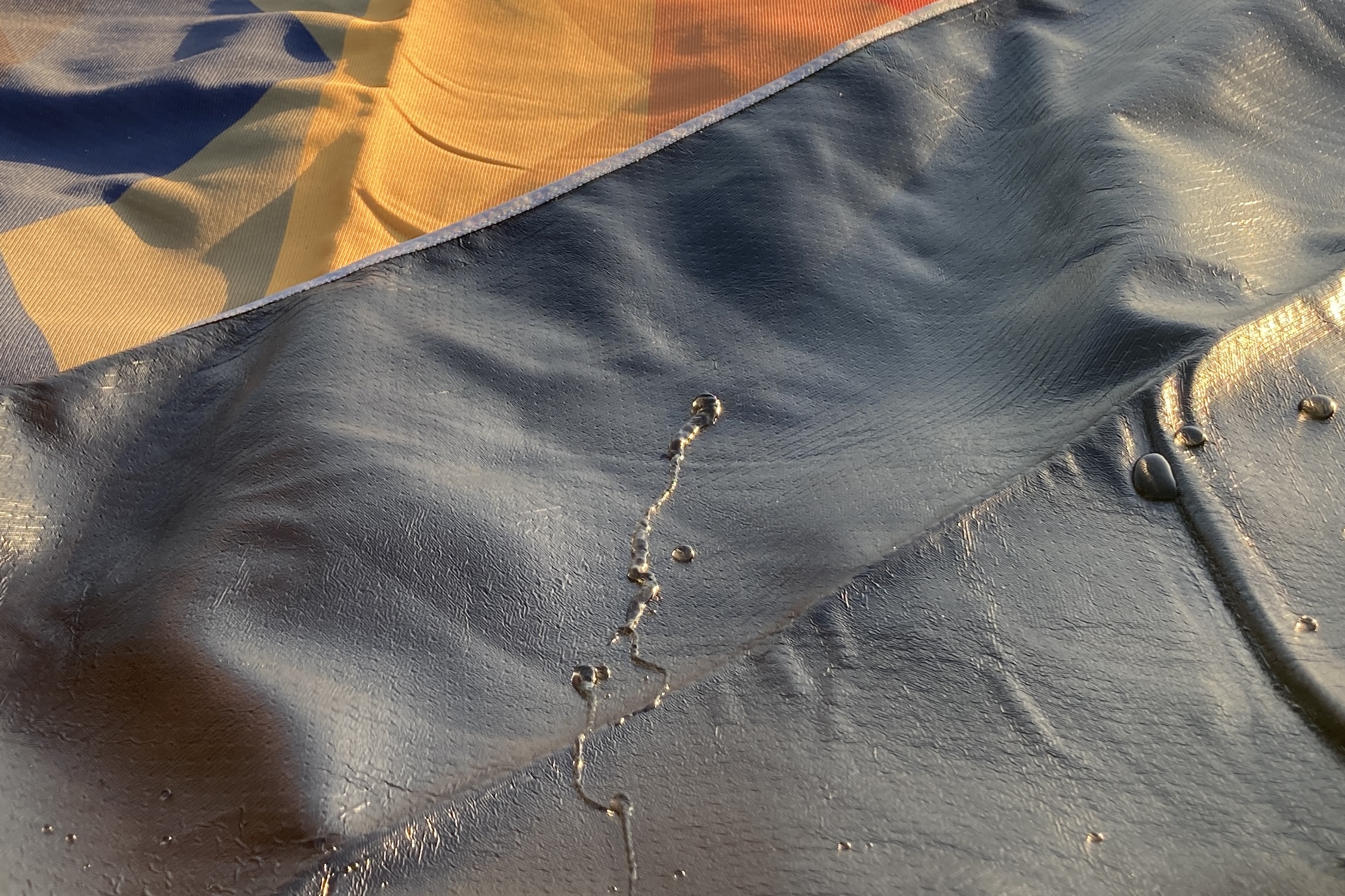 Water beads off easily on both the bottom and top layers of the Nemo Victory Patio Blanket.