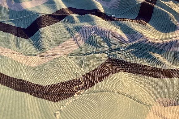 Showing water beading off of the CGear Multimats Sandlite Sand-free Mat.