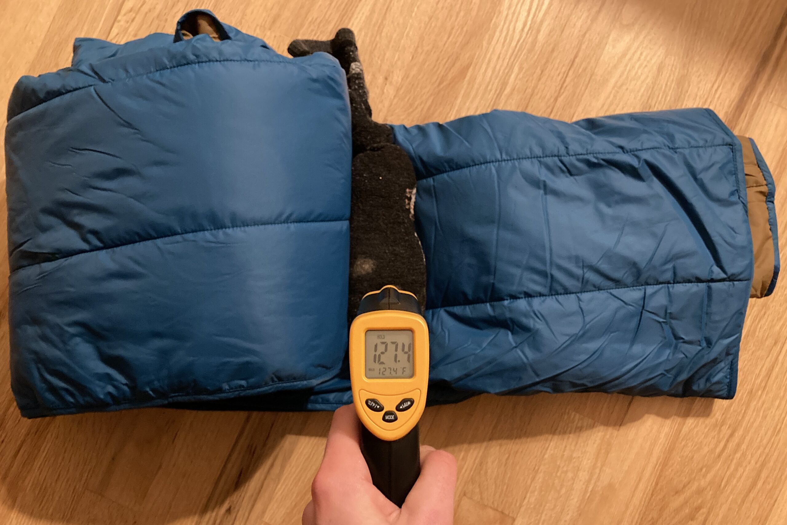 The final reading on the infrared thermometer after the warmth test with the REI Camp Blanket. It reads 127.4F