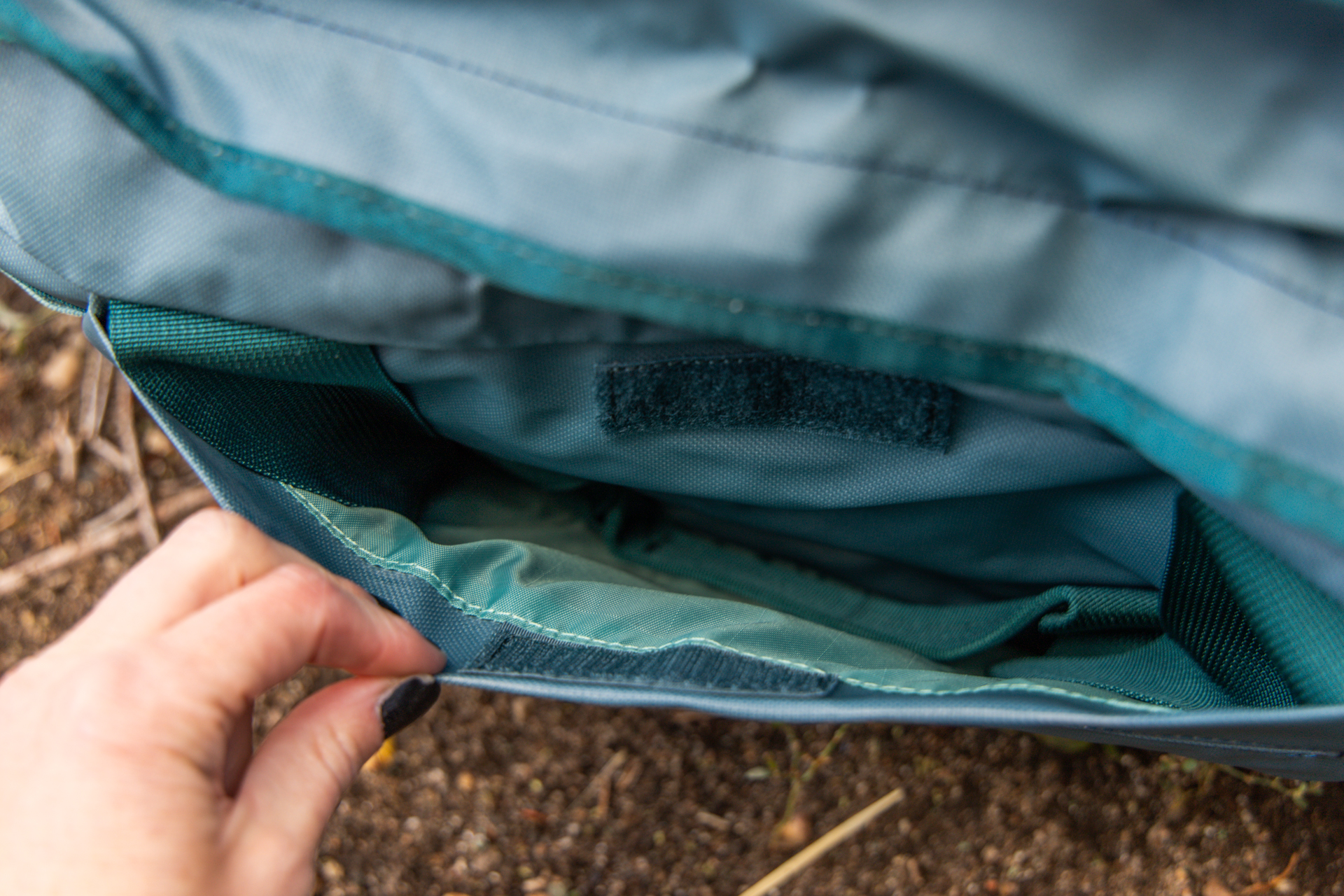 A view into the side stash pockets with the grab handles tucked away inside.