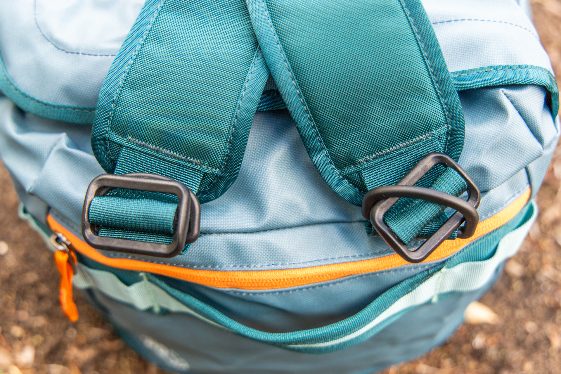 A detail shot of the D-rings that connect the pack straps to the top end of the Cotopaxi Allpa 50L duffel.