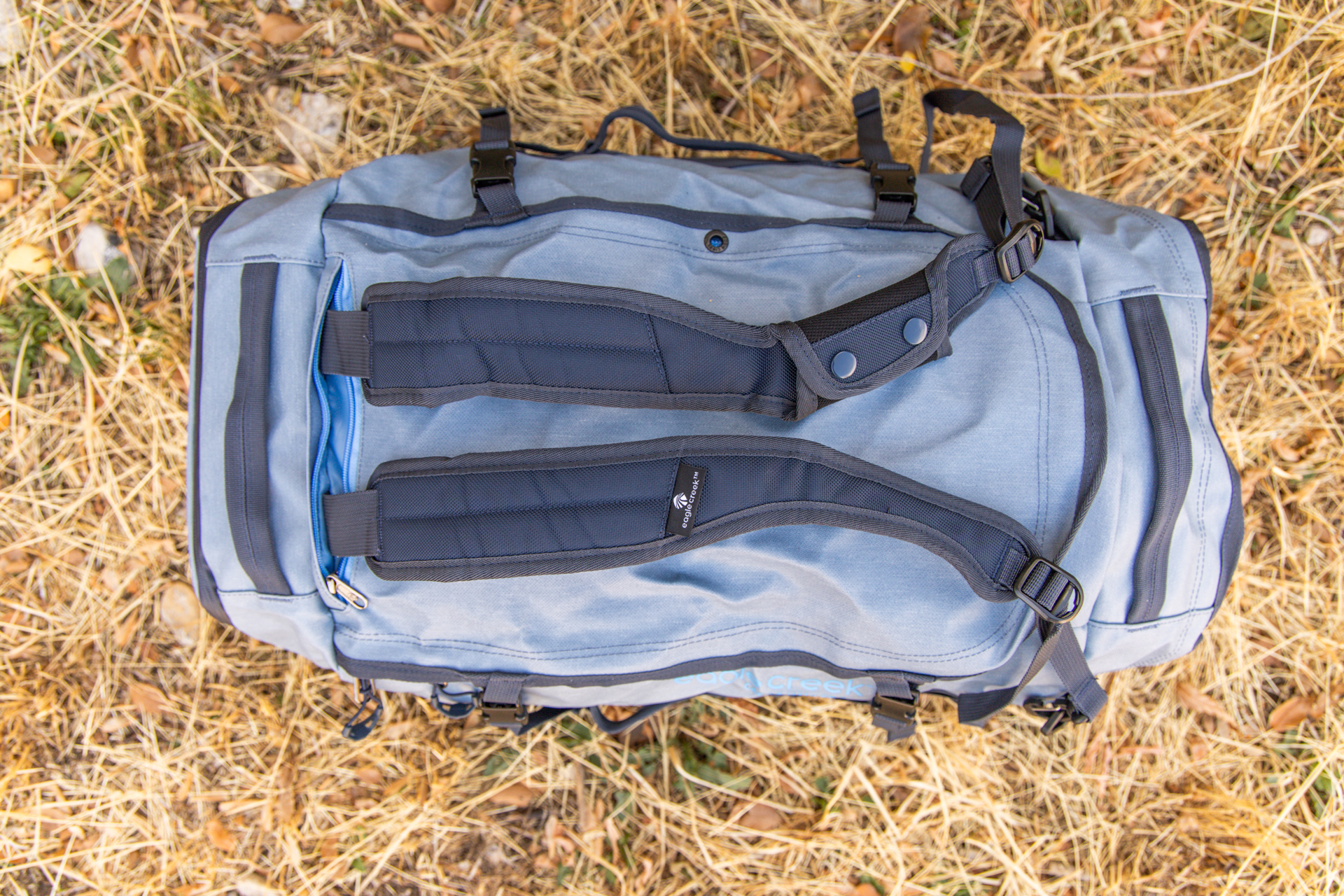 The stowable backpack straps viewed from the top down on the Eagle Creek Cargo Hauler 60L duffel.