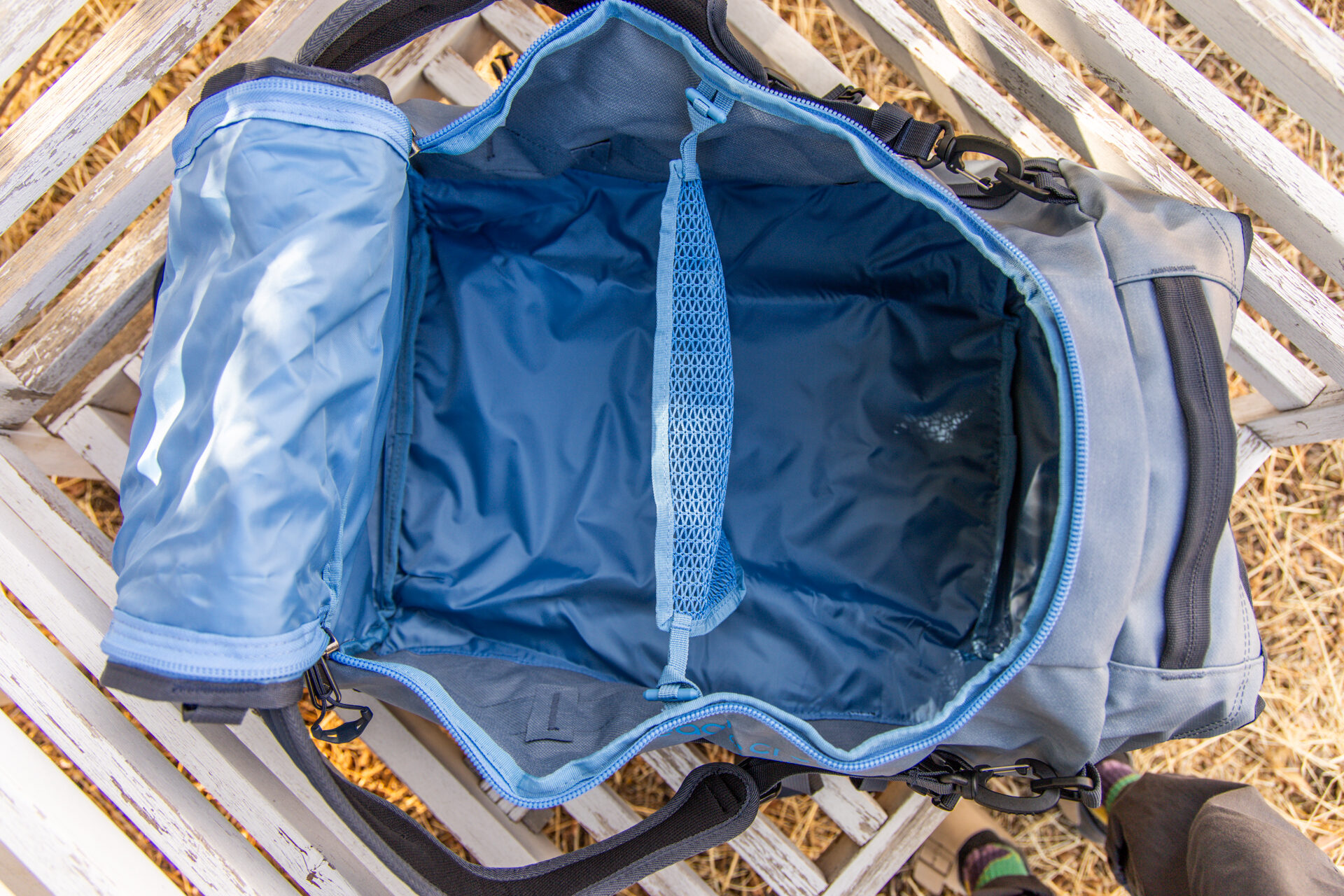 An interior view of the Eagle Creek Cargo Hauler 60L duffel with mesh divider in place.