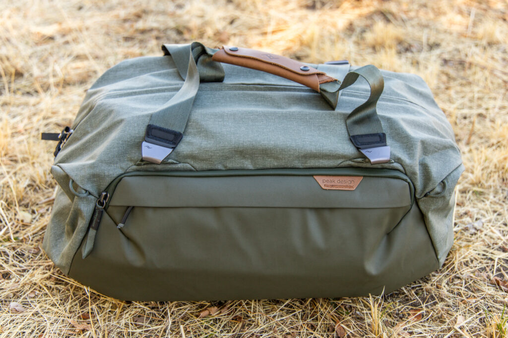 The exterior of the Peak Design Travel Duffel with duffel straps attached.