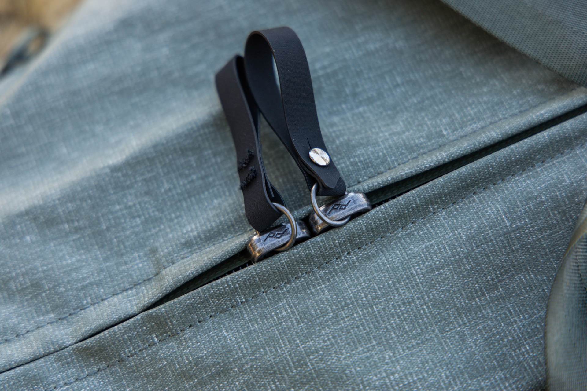 The lockable waterproof zippers on the main compartment.