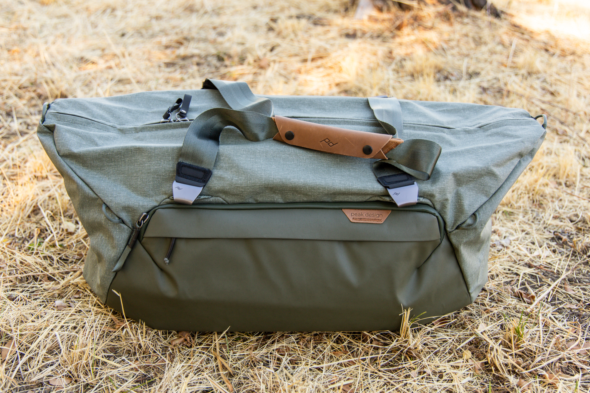 The side flaps of the duffel folded outward.