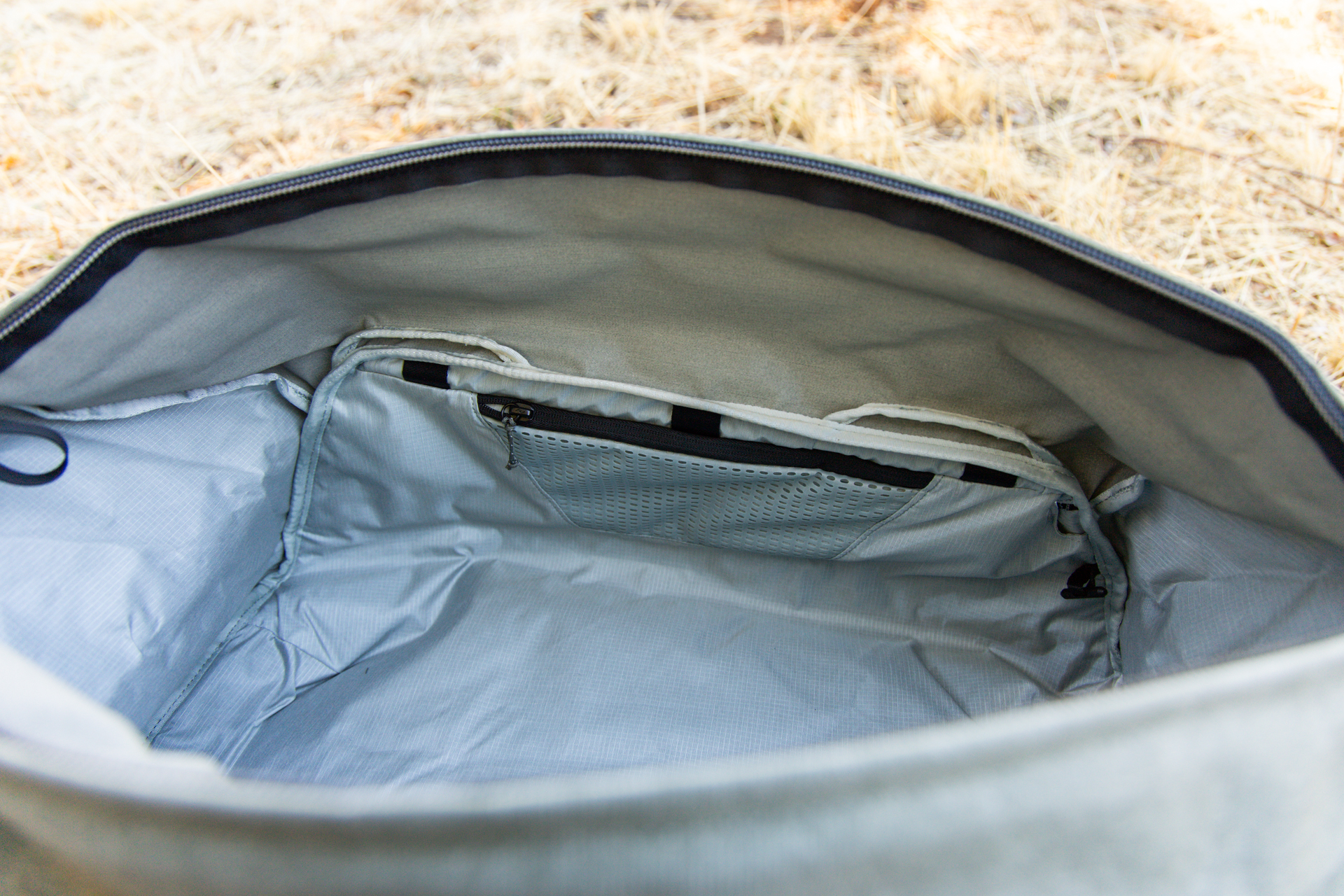 Inside the bag: a small mesh zipper pocket on one side.