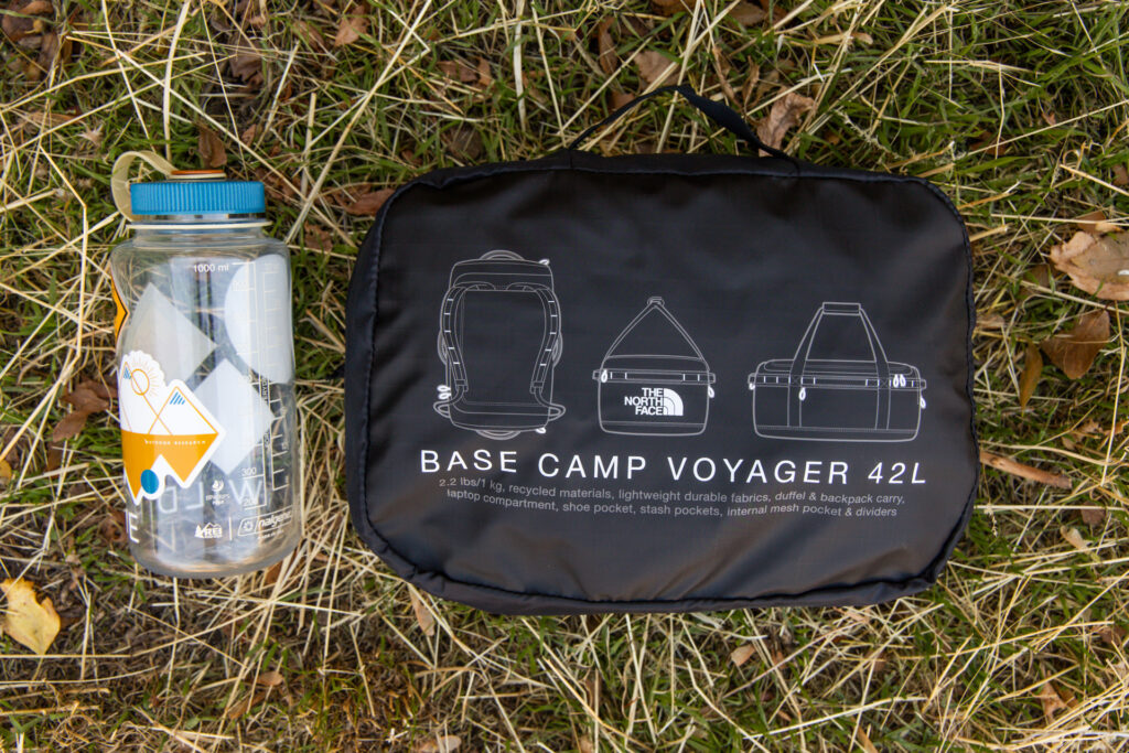 The Base Camp Voyager Duffel Packed into its own pocket and placed next to a Nalgene for size reference.