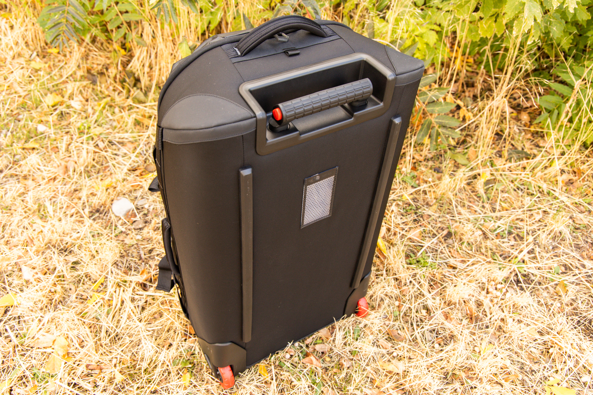 A back view of the Rolling Thunder with a clear ID car sleeve, retracted handle, and sturdy protective rails on the back.