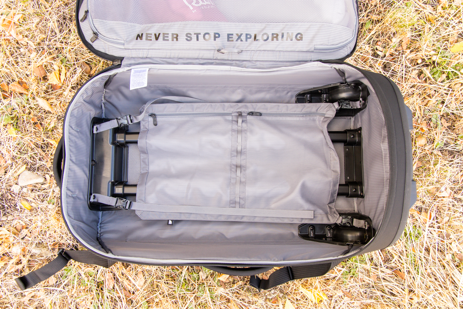 Inside the bag: the compression panel with two zipper pockets is clipped in place.