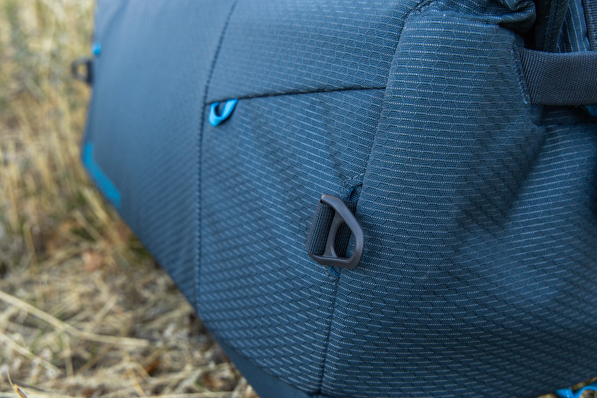 A close-up of the durable rings for clipping on the removable shoulder strap.