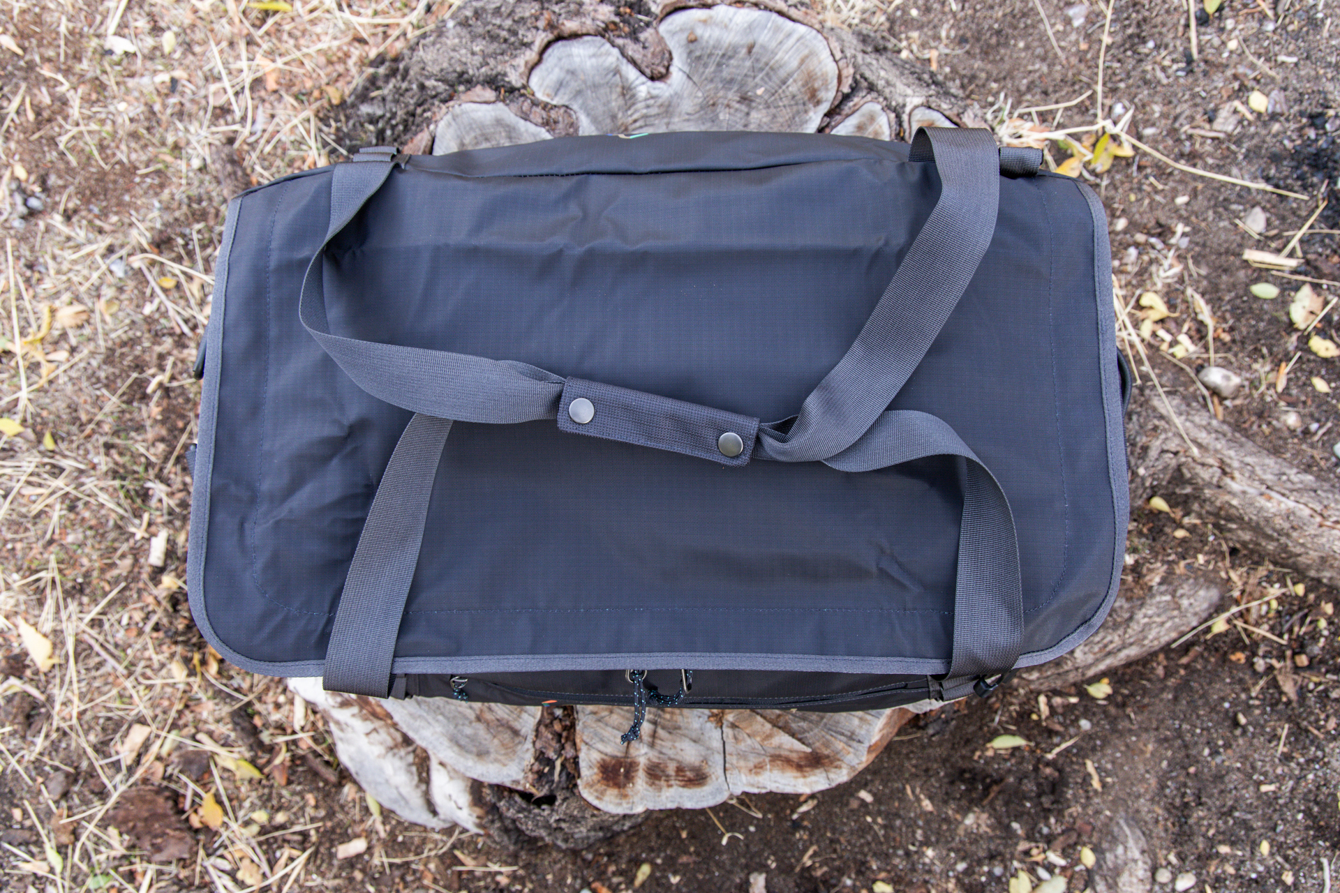 A top-down view of the Black Hole with pack straps removed and duffel handles snapped together.