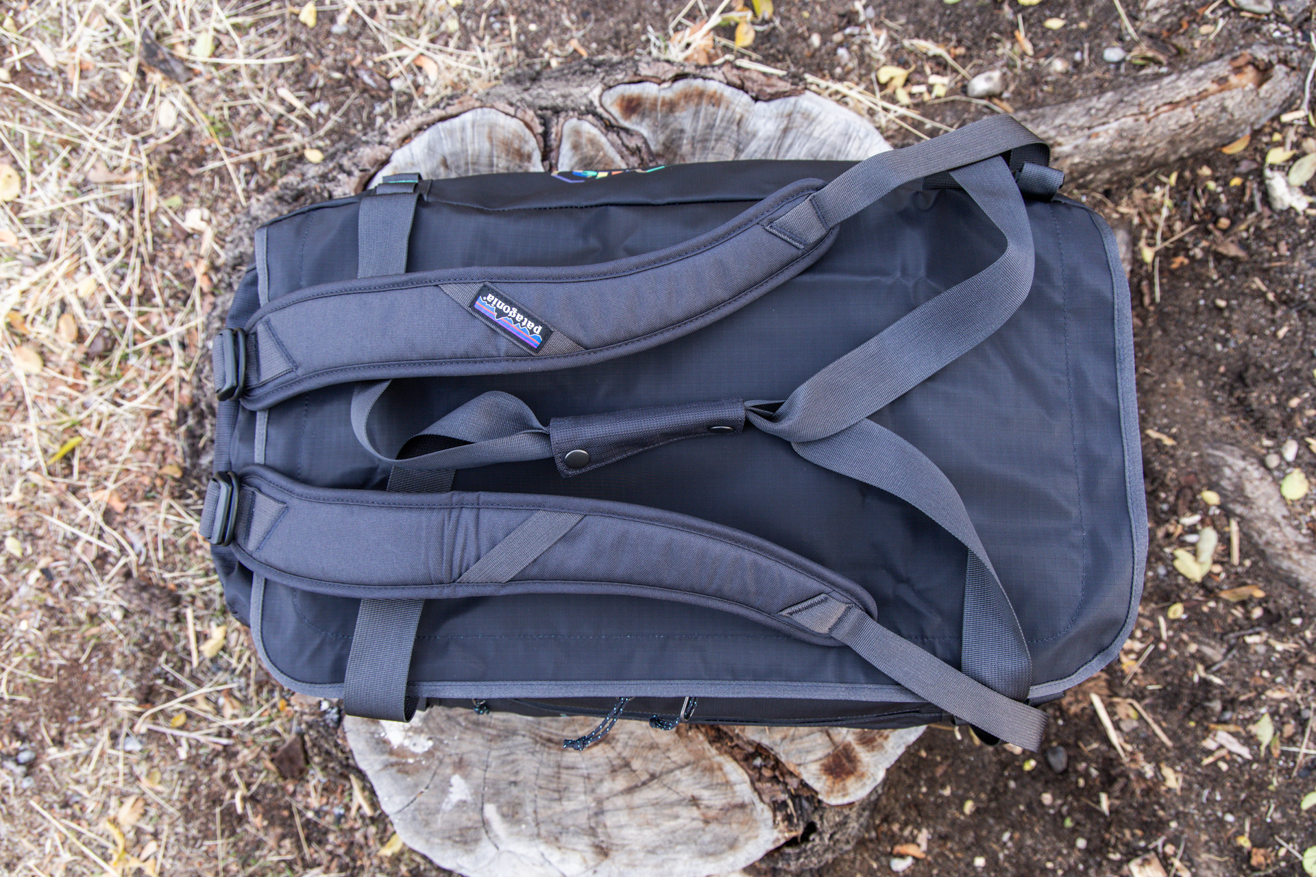 A top-down view of the Patagonia Black Hole with pack straps attached and duffel handles clipped together.