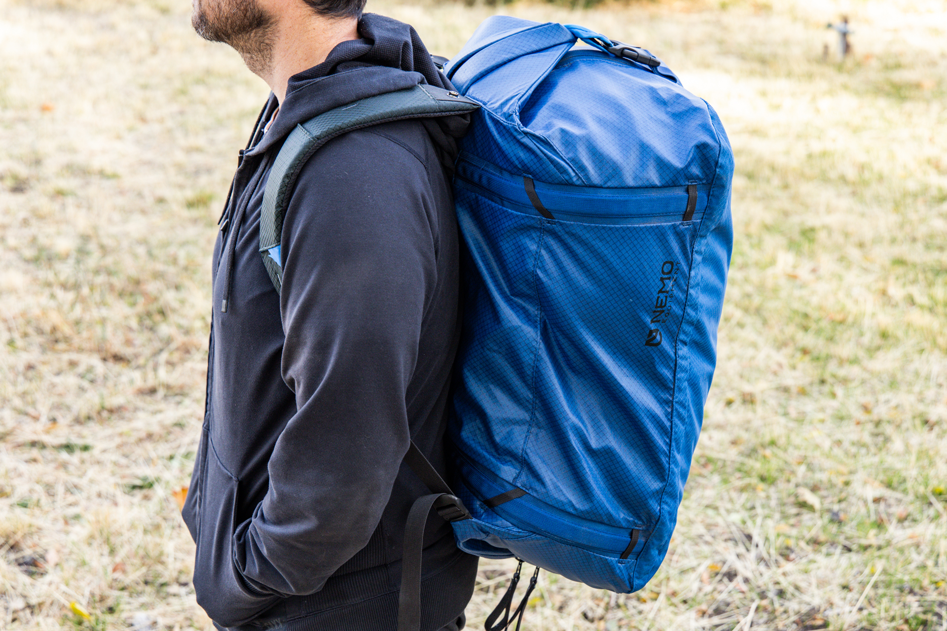 A man carries the Nemo Double Haul as a backpack.