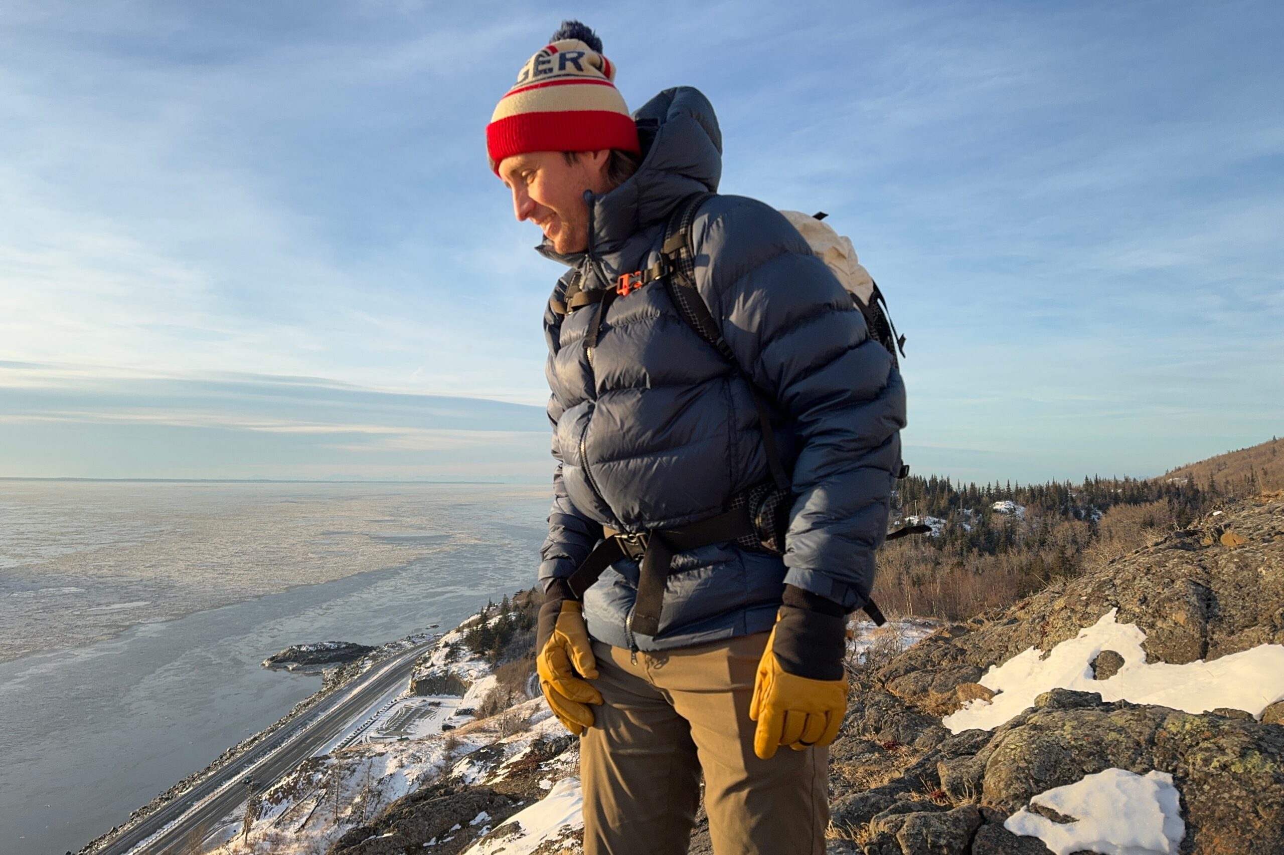 A man overlooks an ocean view in the winter.