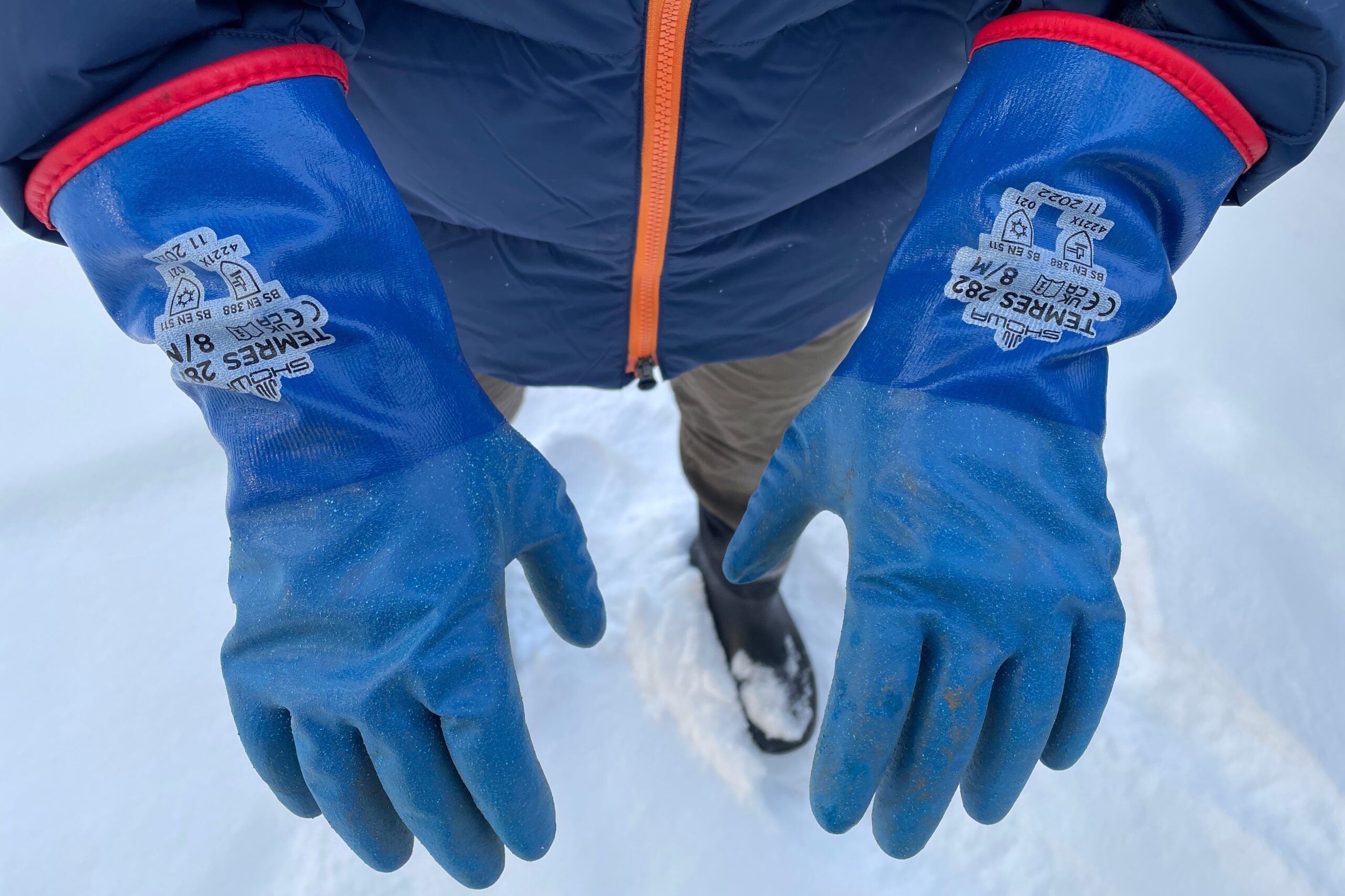 A closeup of the back of the hands of a pair of gloves.