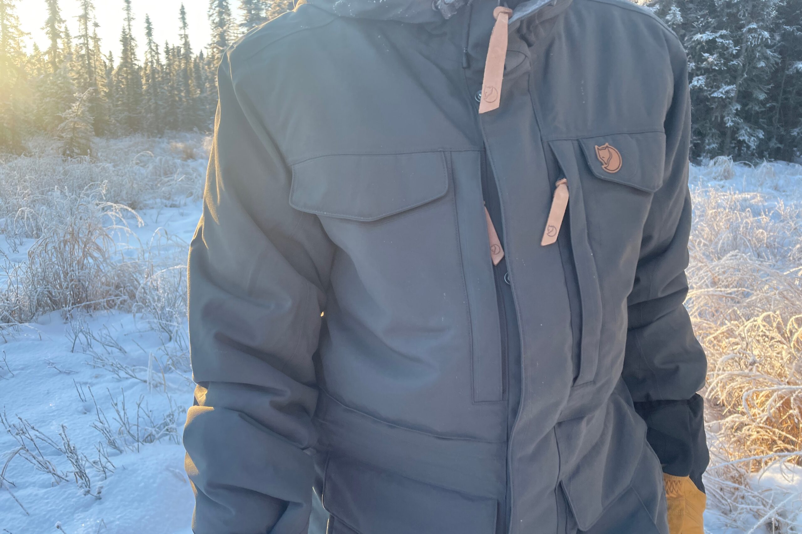 A closeup of the pockets on a winter jacket.