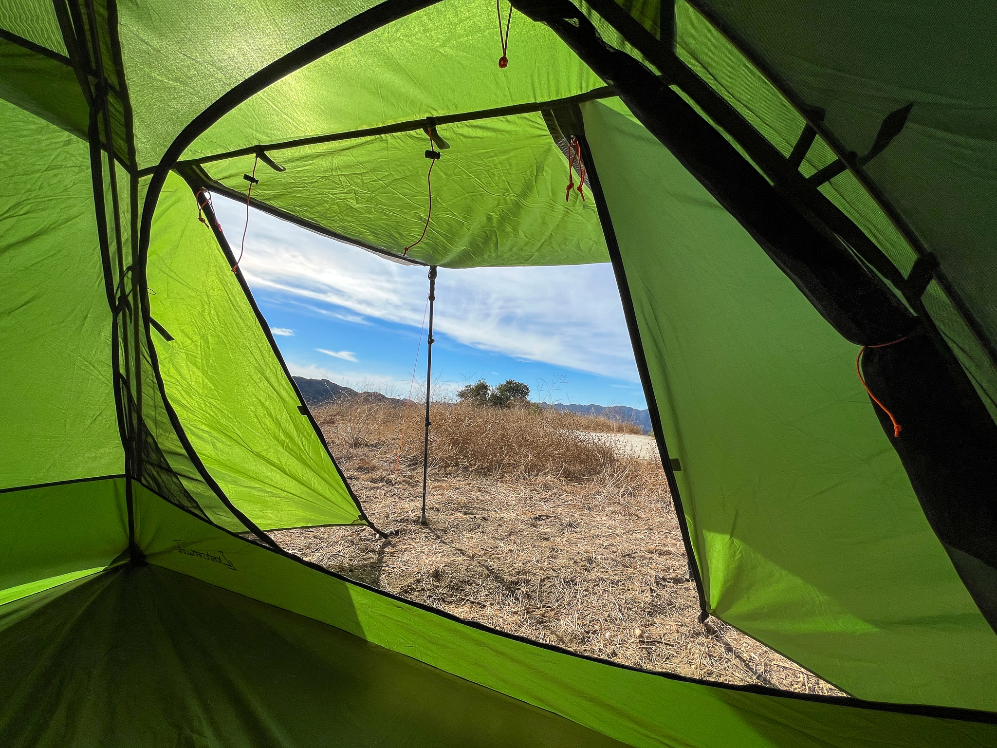 View from inside the Clostnature Polaris looking out the door with the shade awning deployed.