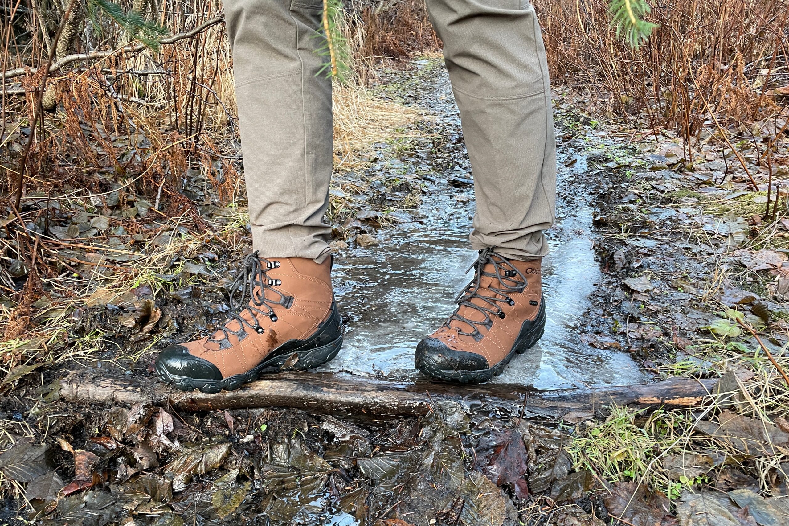 A closeup of boots on an icy trail