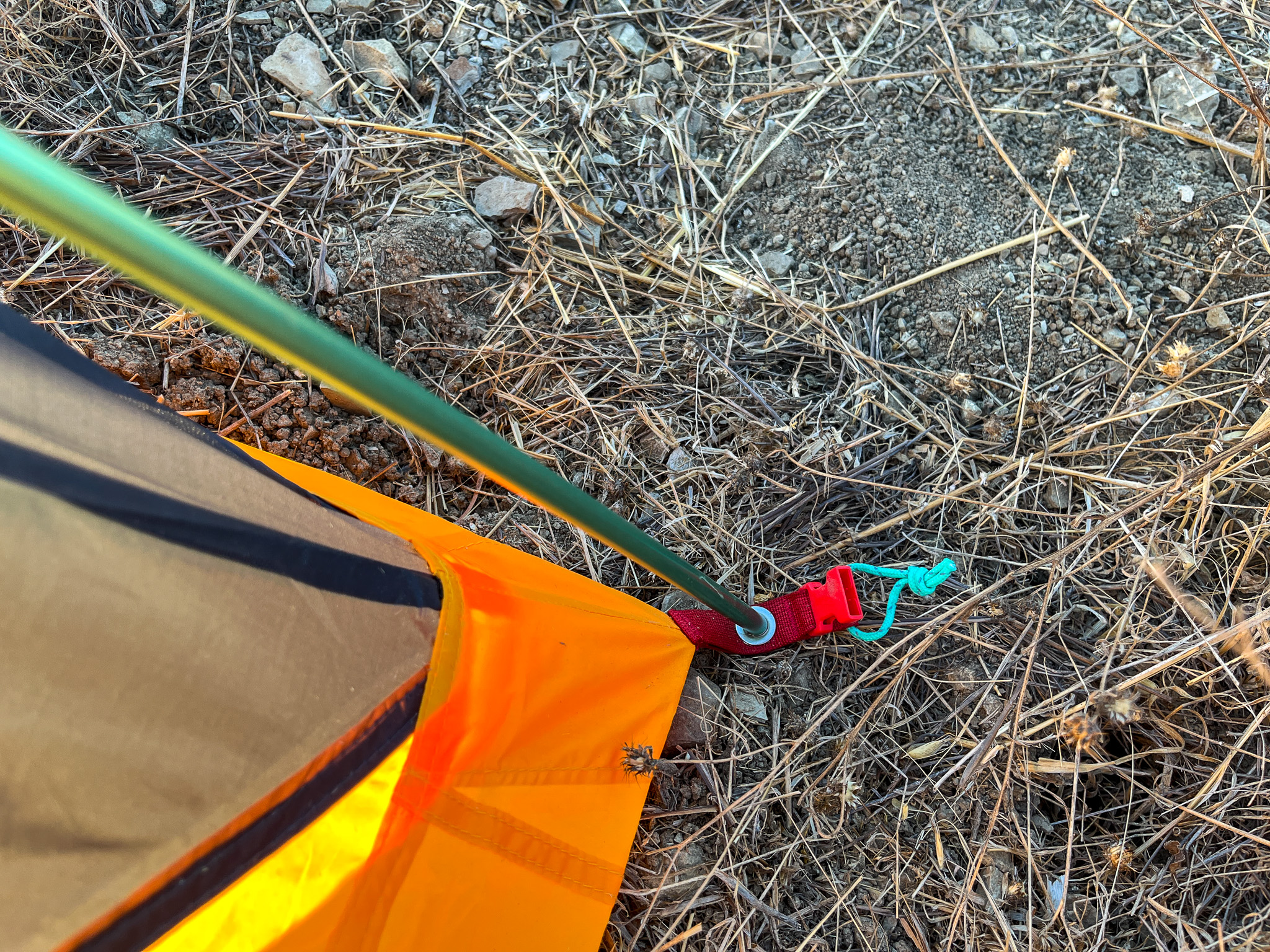 Close up of the pole and grommet attachment system and the clip for the rainfly