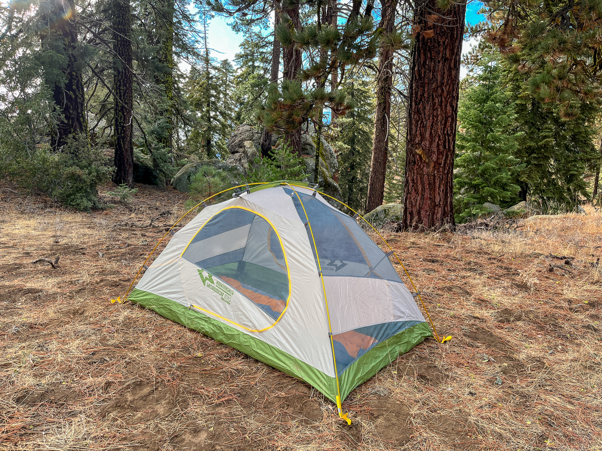 The Mountainsmith Morrison EVO 2 inner tent with no rainfly pitched in a forest with tall pine trees.