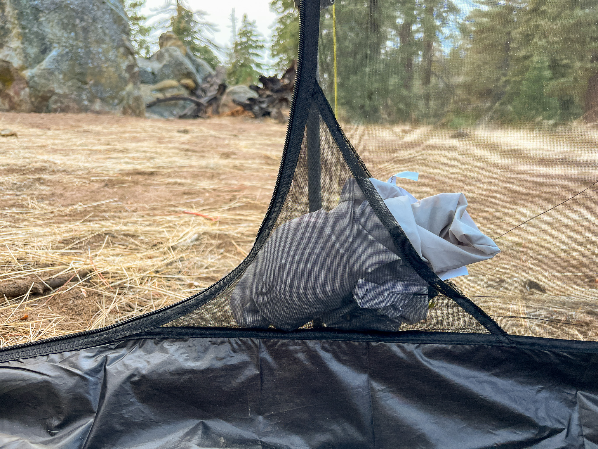 Closeup shot of the interior storage pocket of the Six Moon Designs Lunar Duo Outfitter. Tucked inside is the carrying bag for the tent.