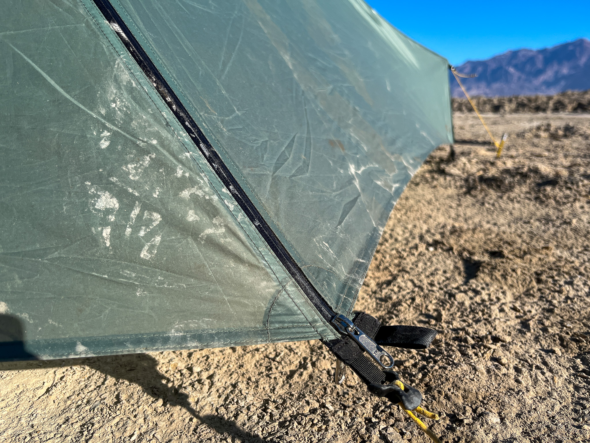 Closeup of the reinforced vestibule corners ,tension adjusters, and water resistant zipper seams.